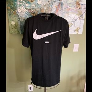 Nike T-shirt in size L.